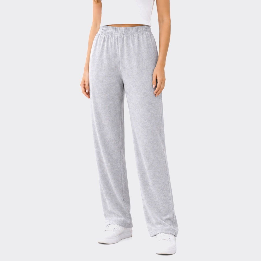 Person wearing gray sweatpants on a white background